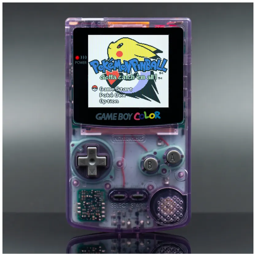 Transparent Game Boy Color photographed against a dark background