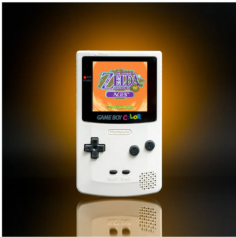 White Game Boy Color with Zelda Oracle of Ages