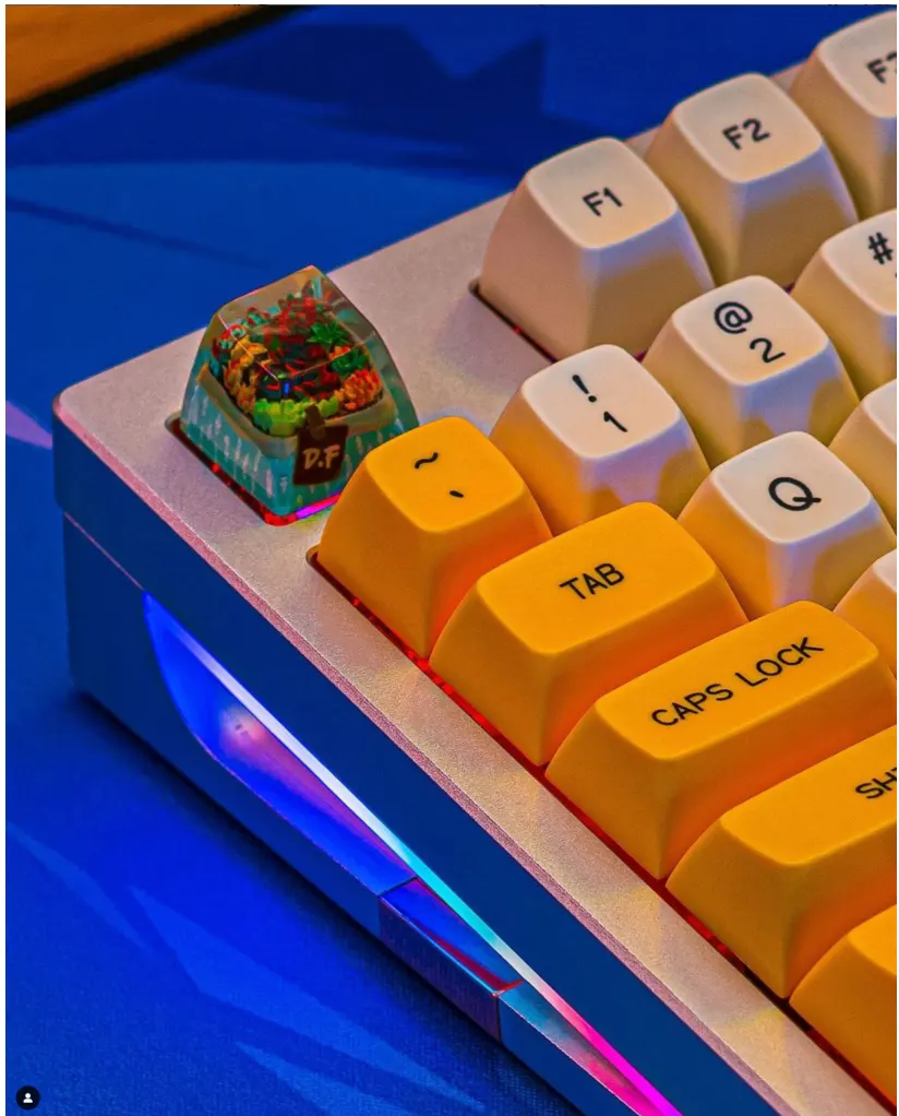 Orange and cream mechanical keyboard with artisan keycap